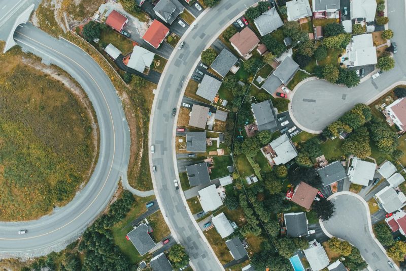 Home 7 Aerial view of a suburban neighborhood with curved roads and 1779210070