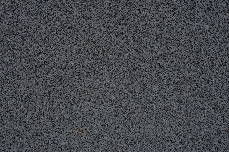 Detailed view of a gray synthetic doormat showcasing its fib 1786467764